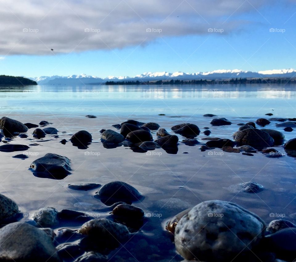 The reflection off New Zealand’s Lake at Te Anau, just as the clouds lifted to reveal those gorgeous snow-capped peaks.