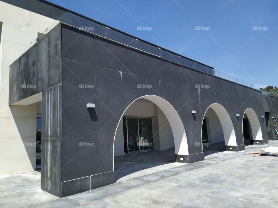 This is the facade of my friend's company. Represents the ancient Sicilian style adapted to a contemporary architectural design. it is located in an enchanting location overlooking the Ionian sea in front of Acitrezza and Acicastello.