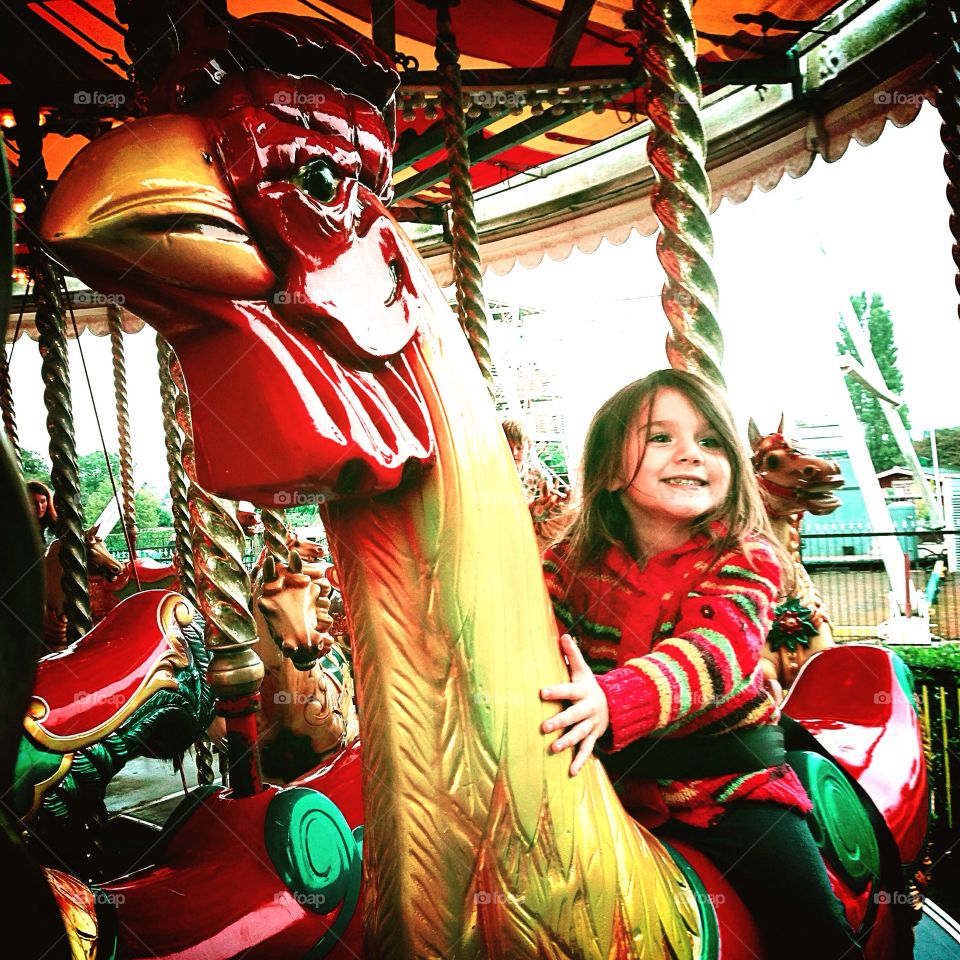 Child on carousel 