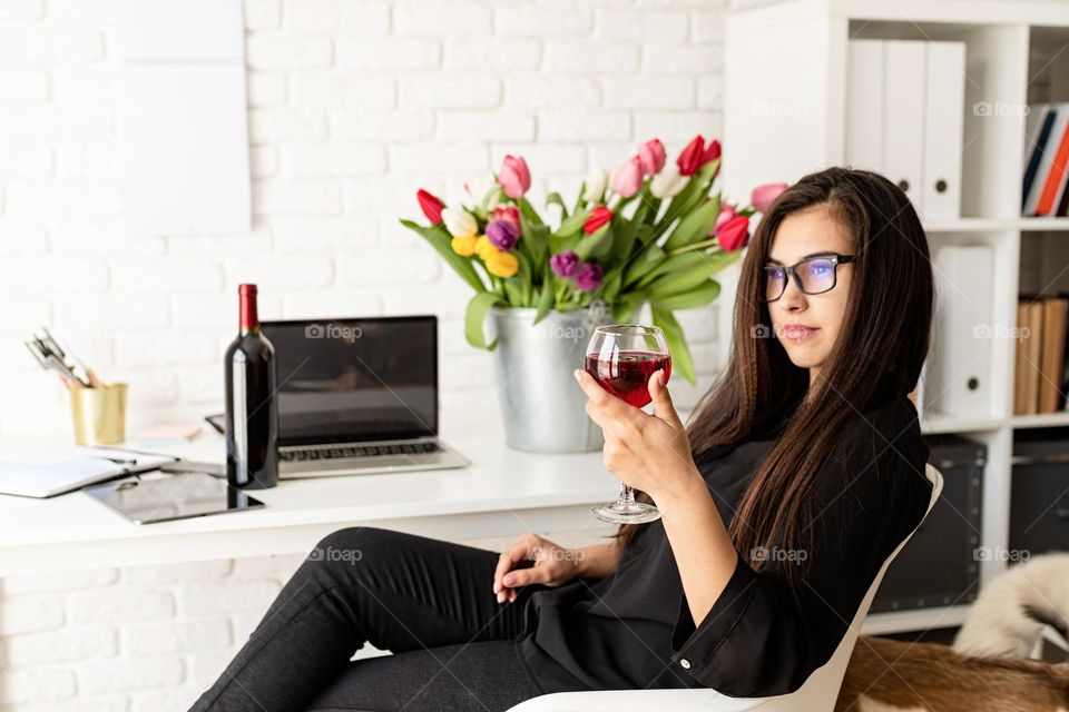 woman drinking wine at home