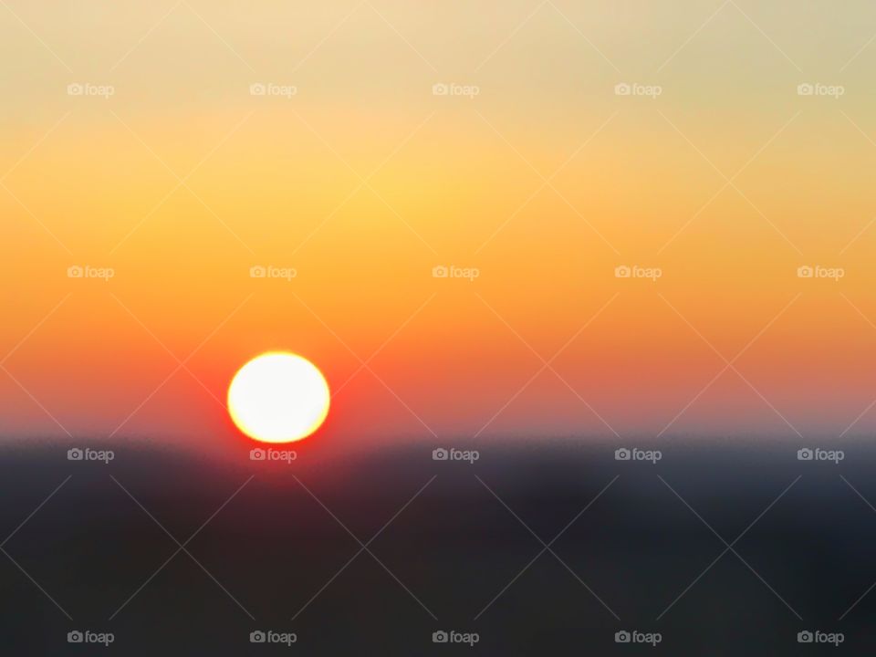 Blurry out of focus sunset in beautiful warm colors