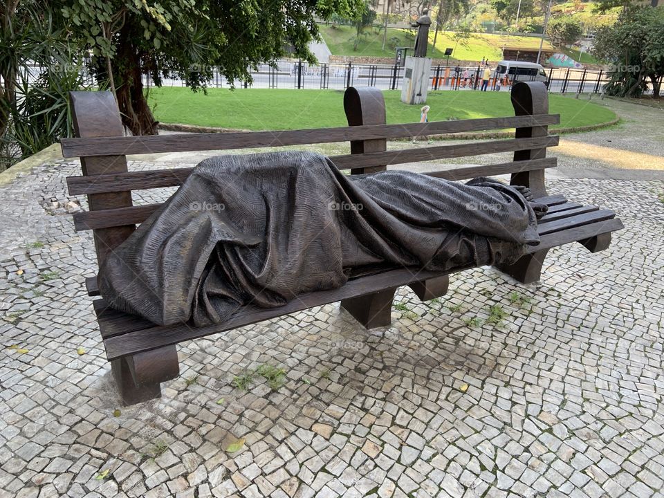 Homeless statue on beach. Rio de Janeiro 