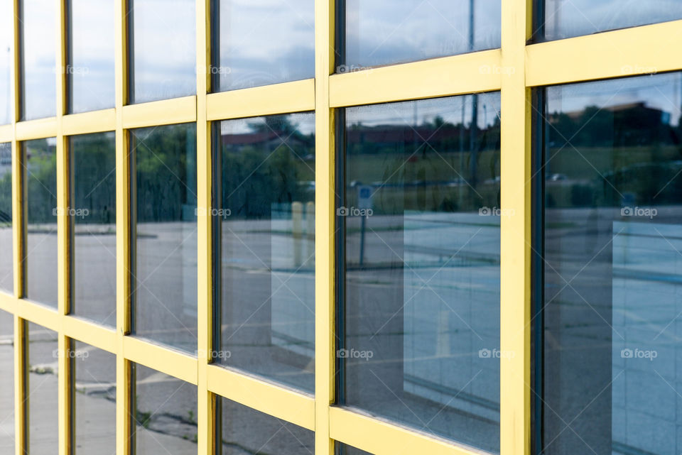 Close-up of a wall of yellow square windows