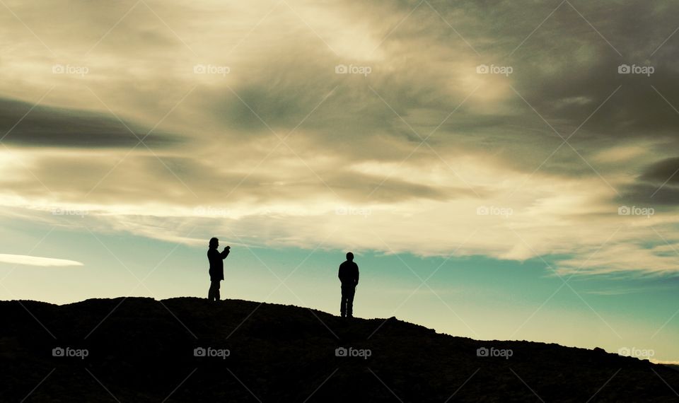 Silhouettes of two men