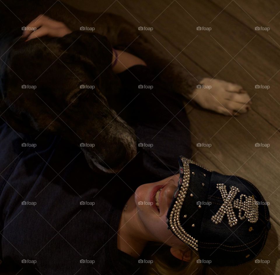 Popfizzy Bling Jean “Skull and Crossbones” baseball cap; on floor with dog