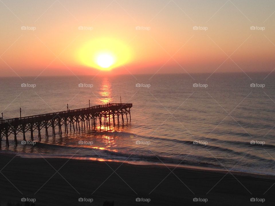Delight. The is an awesome sunrise in Myrtle Beach South Carolina in the month of October.  Family and friend or your love one 