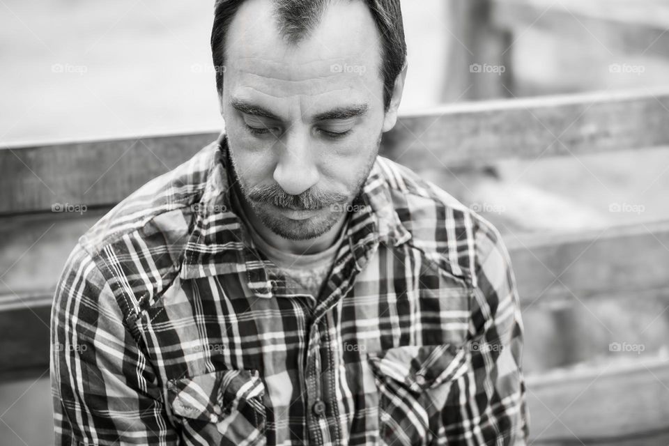 B&W image of a man with a moustache 