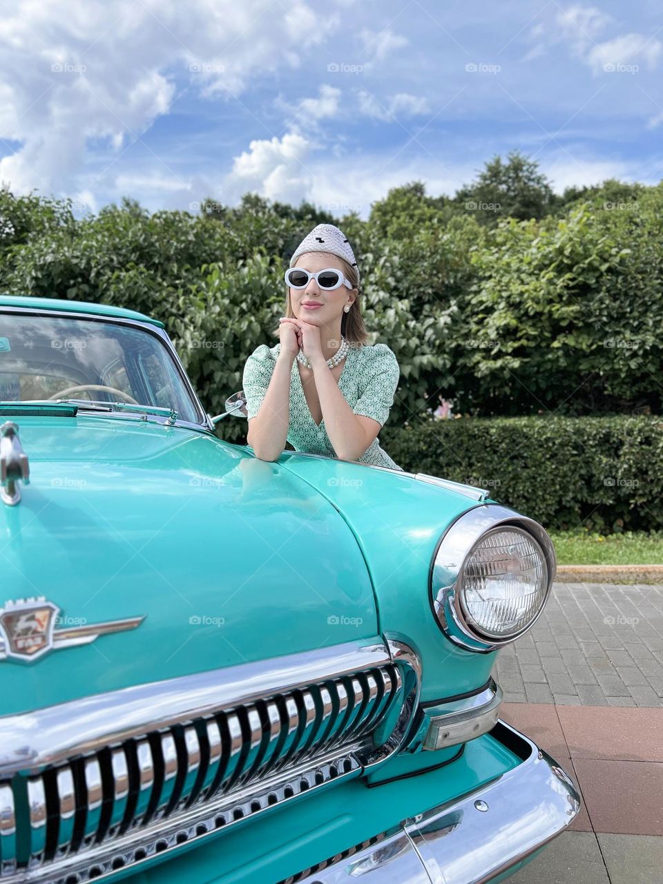 girl near a retro car