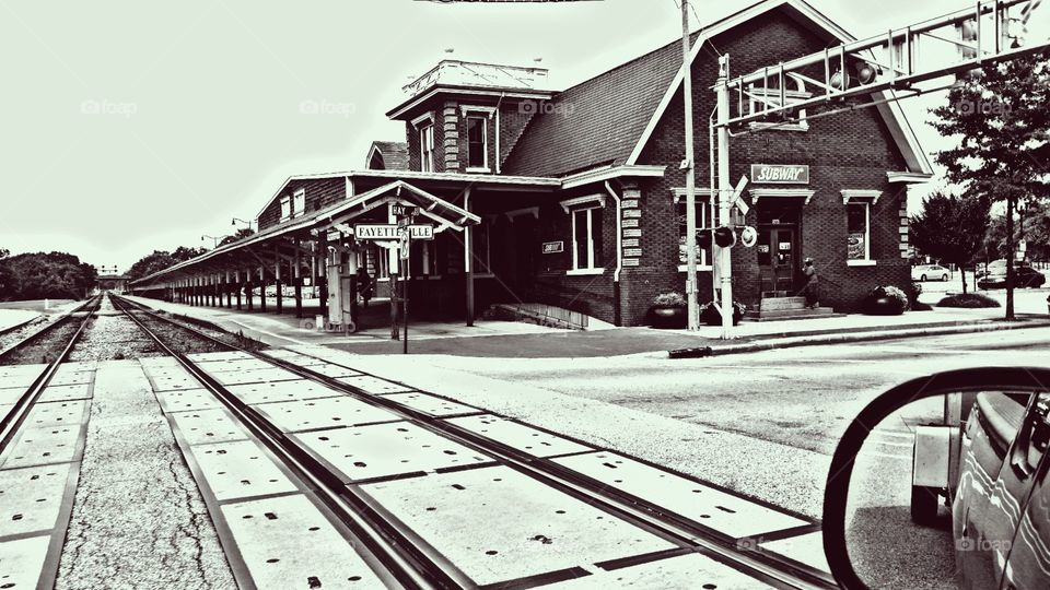 An drive-by street view of a historic but still functioning Amtrak station.