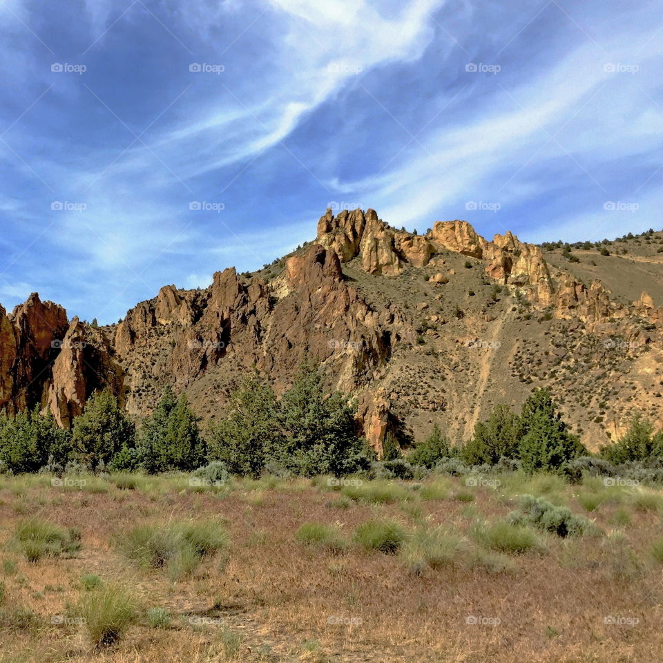 The jagged boulders on the hills in Smith Rocks State Park in Central Oregon on a nice day. 