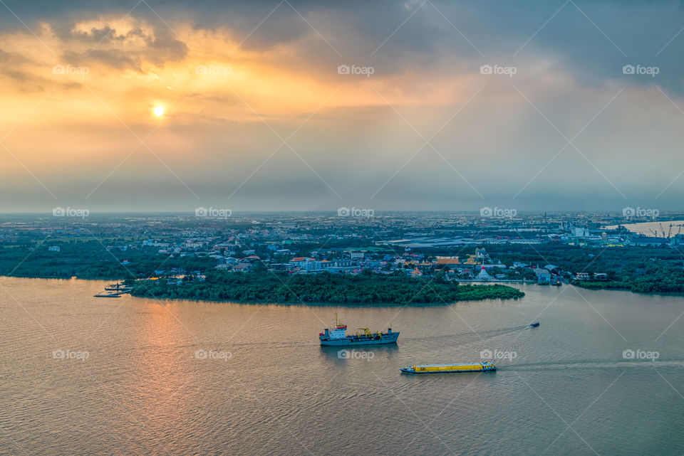 Bangkok city scape and boat in the river