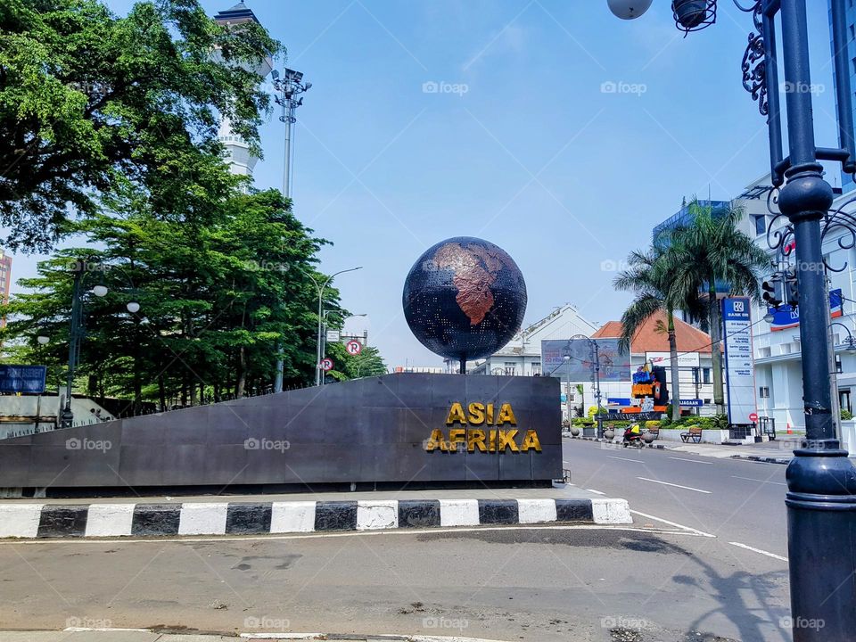 Bandungan global monument, commemorative monument to asia africa conference, asia africa street, in bandung alun alun area, asia africa writing in gold, globe made of corrosion metal, opper metal