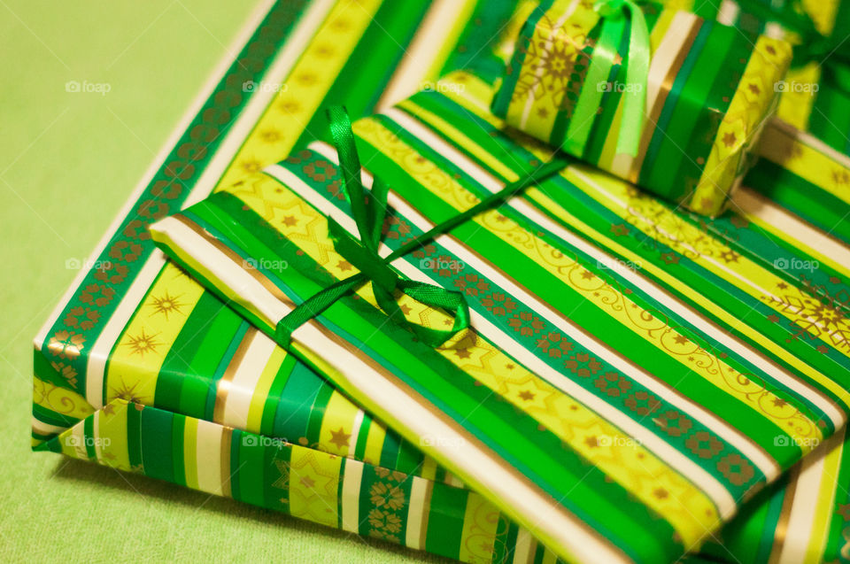 Few presents in green paper 