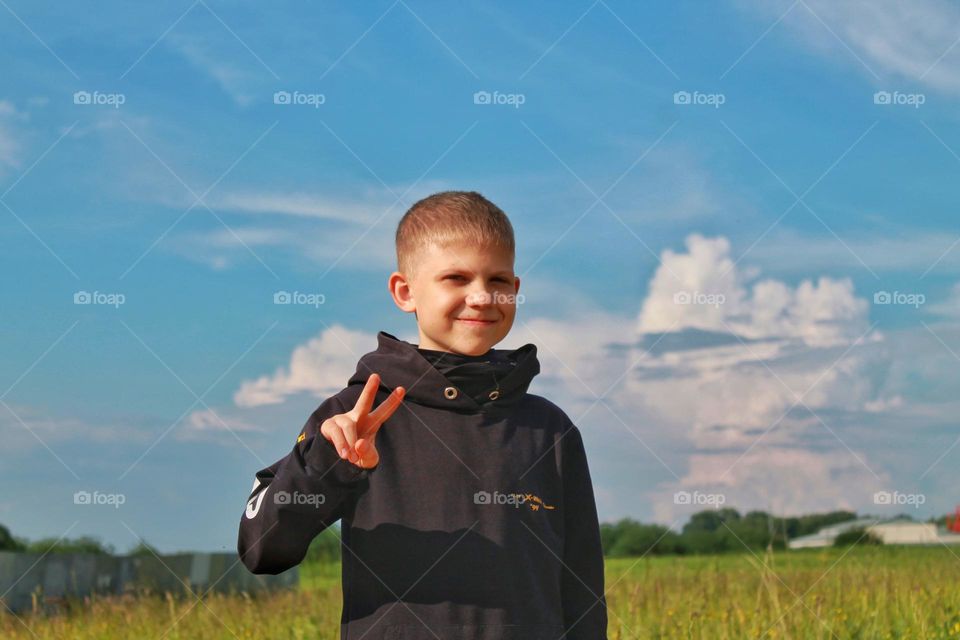 smiling boy on the field. portrait