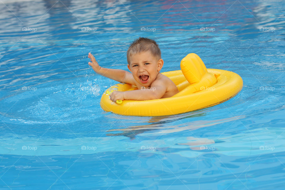 the boy is swimming