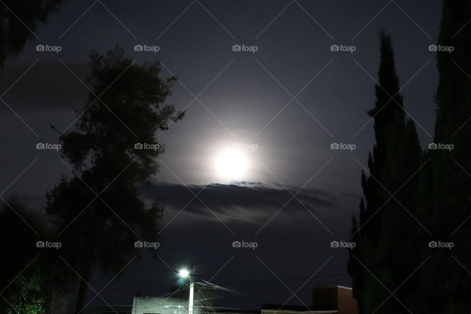 Moon behind mist and clouds 