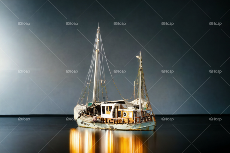 boat reflection on still surface