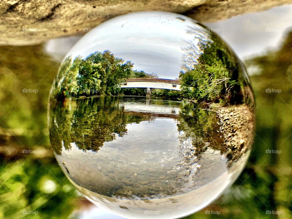 Covered bridge in Indiana through a glass ball