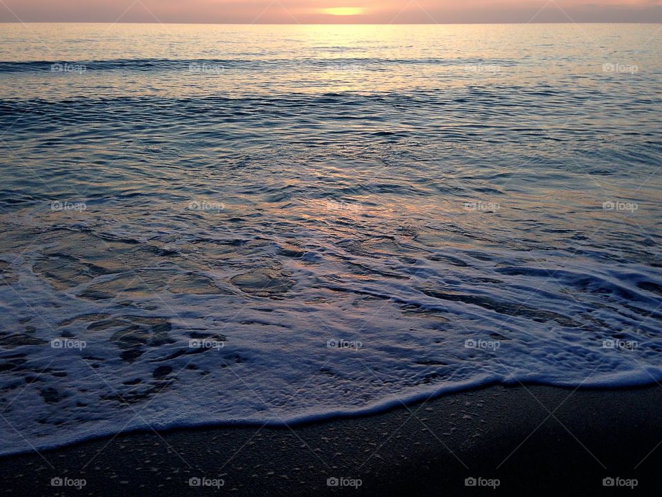 Ocean tides at sunset.