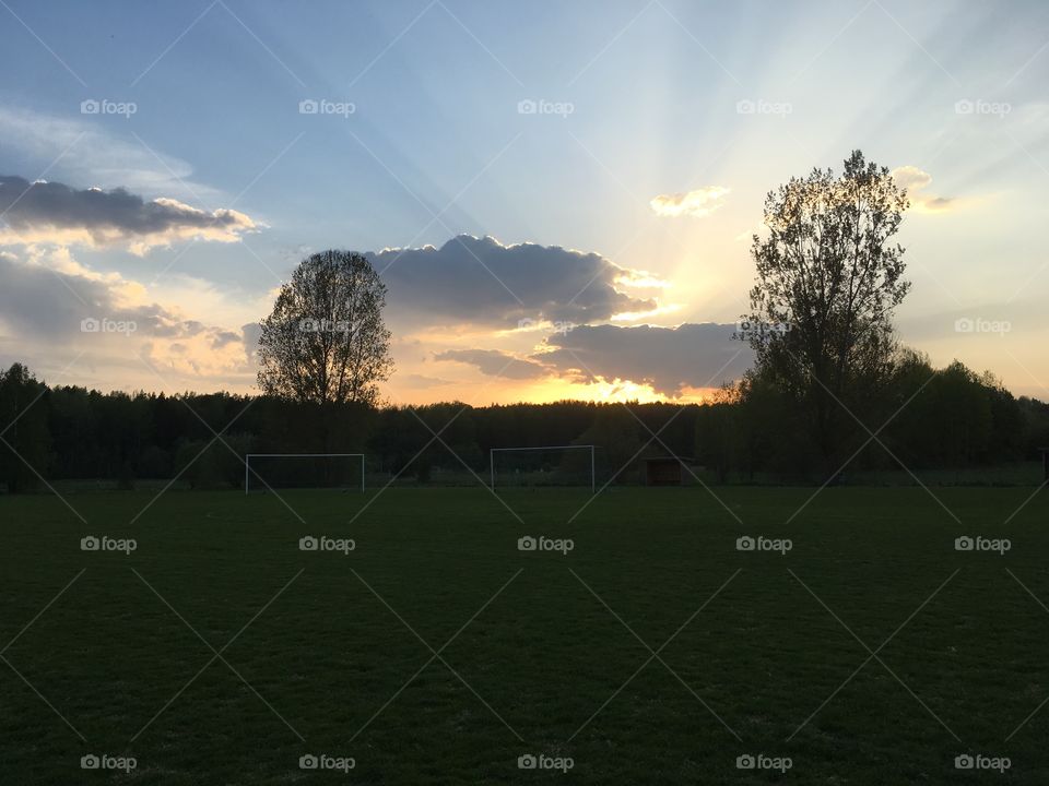 Buteful sunset on a soccer field.