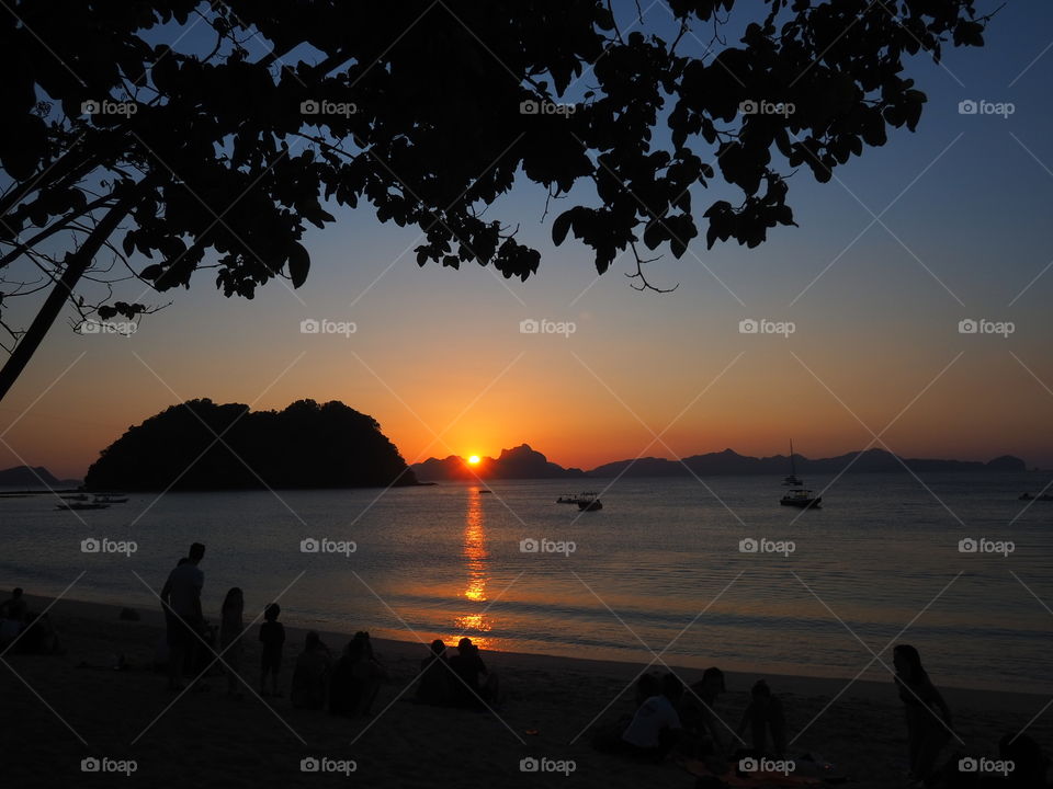 People watching the sunset at the beach 