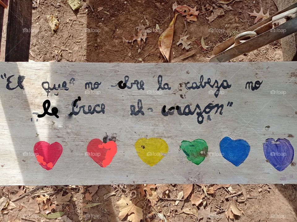 hearts and phrase on bench for Pride month