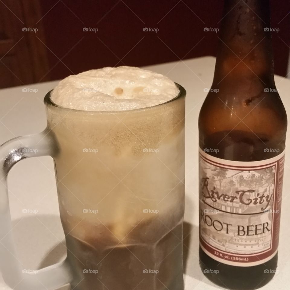 Root Beer Float. Typical float with vanilla ice cream  in a frosted mug