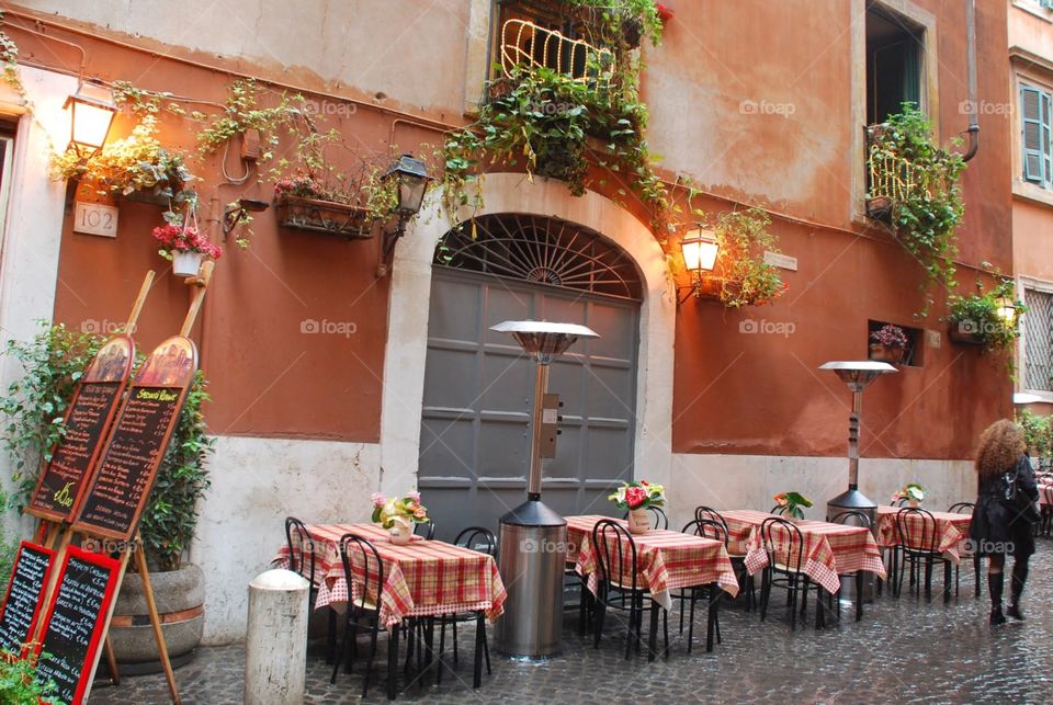 Open seating. Empty tables at an old outdoor cafe 