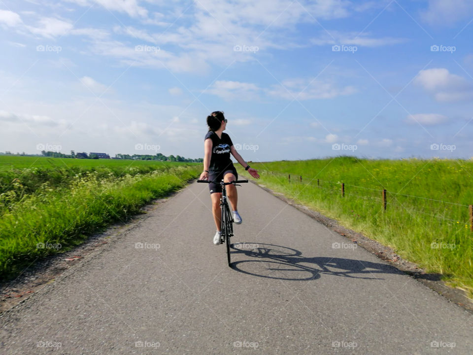 Girl riding a bike in the countryside