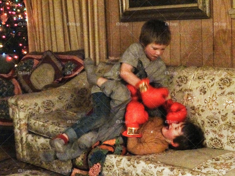 Sibling Rivalry. Brothers Fighting With Boxing Gloves