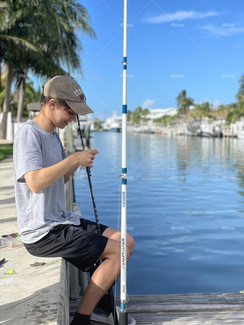 Boy fishing in canal