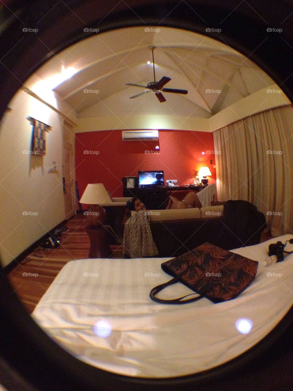 A hotel room through a wide lens