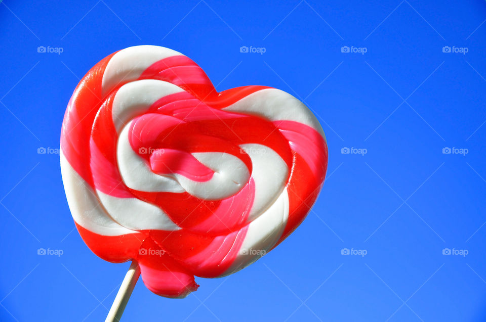 Clash of colors. Heart lollipop.