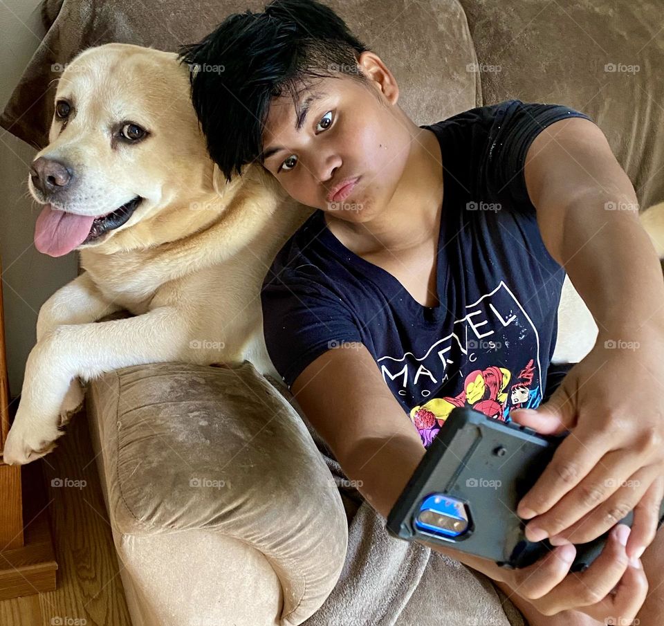 Girl taking a selfie with her dog 