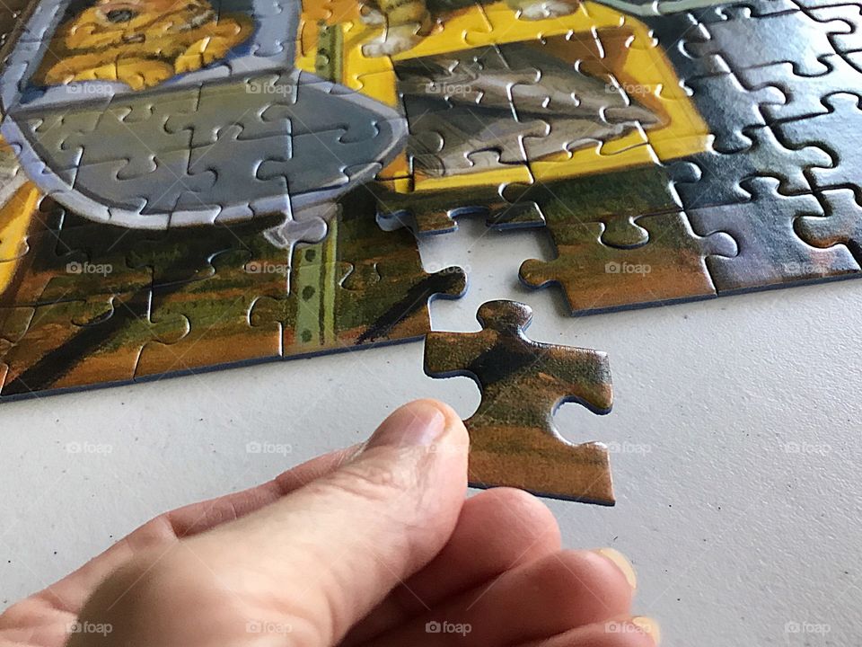 The success of completing a difficult but relaxing jigsaw puzzle.