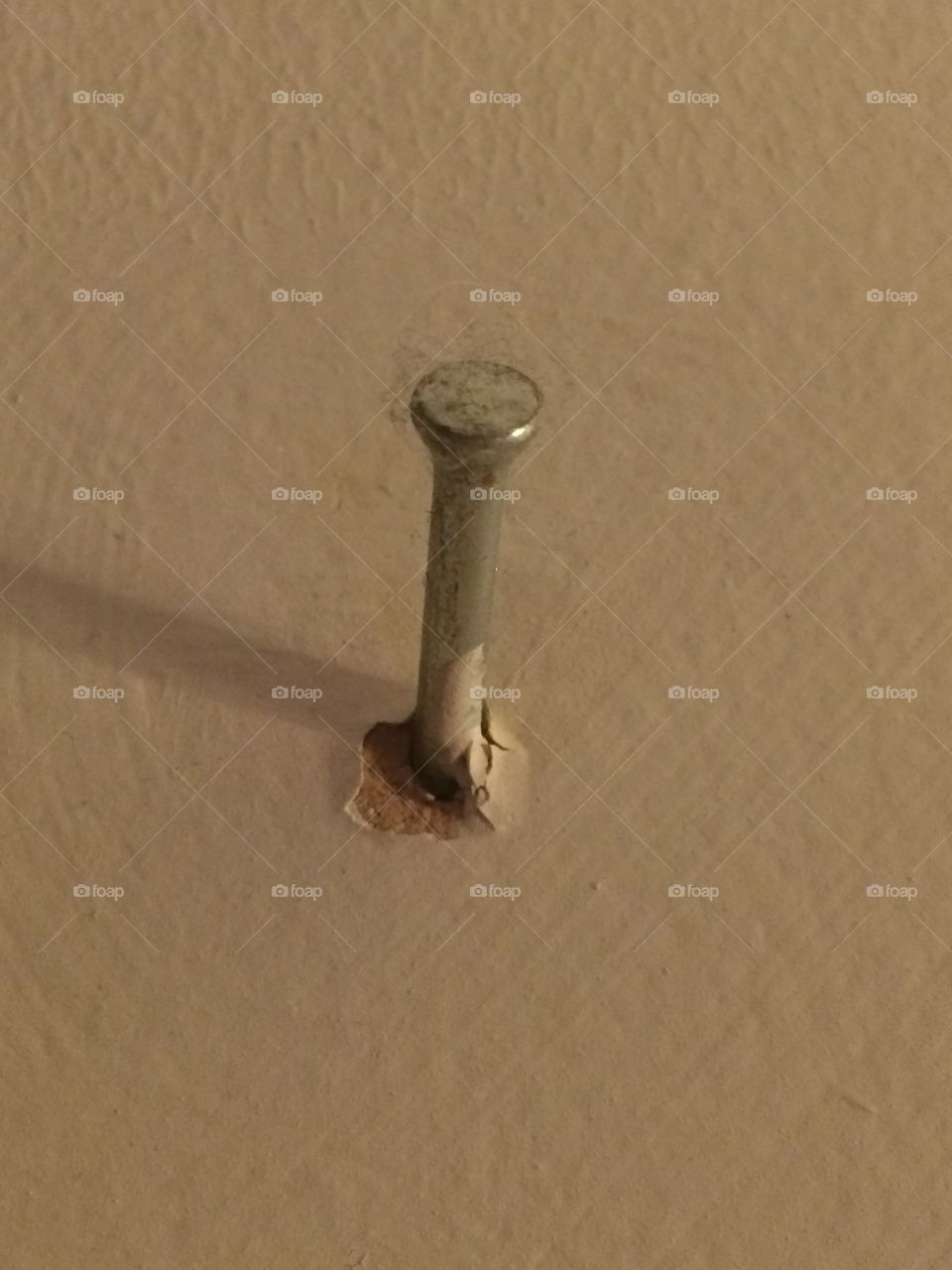 Nail in the wall