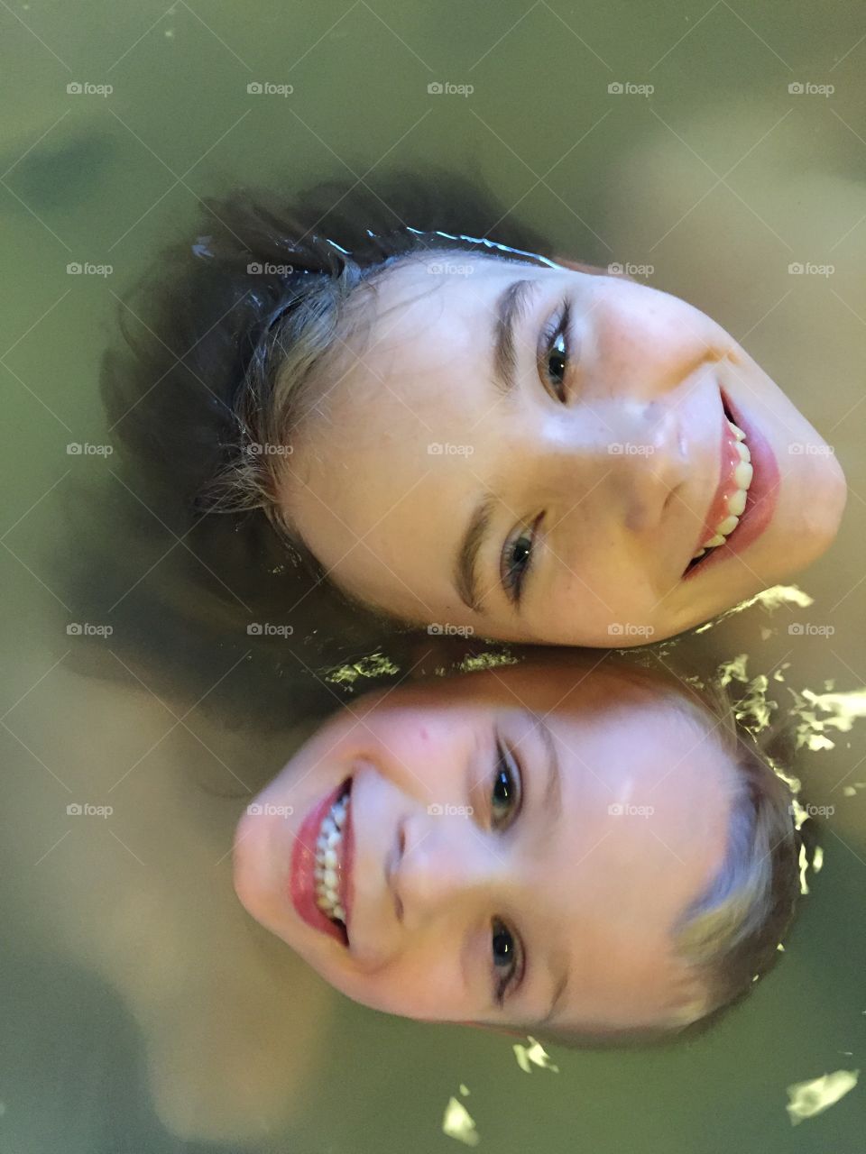 Brother and sister bathing