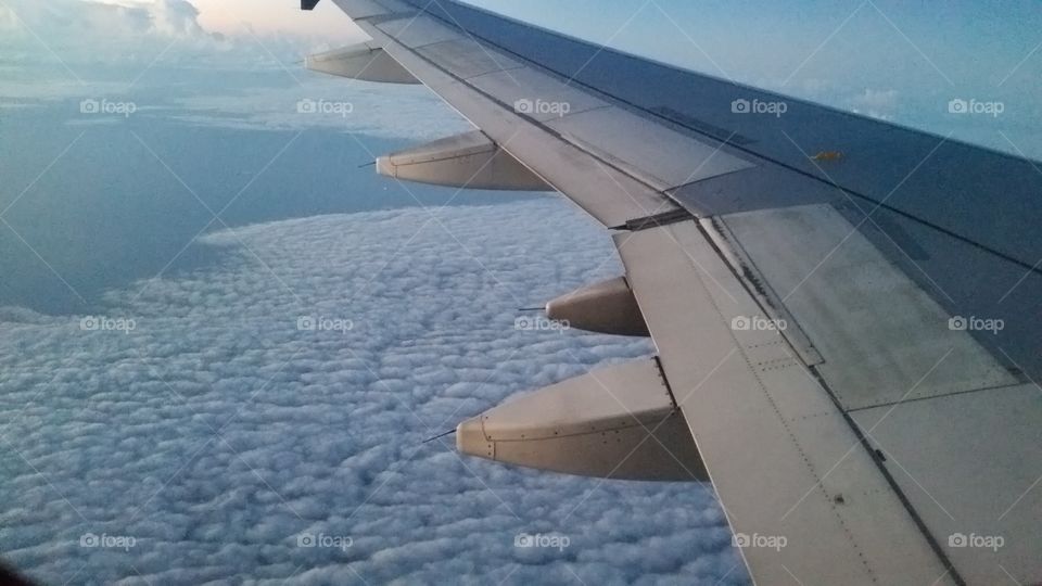 Flying high above the clouds in the sky