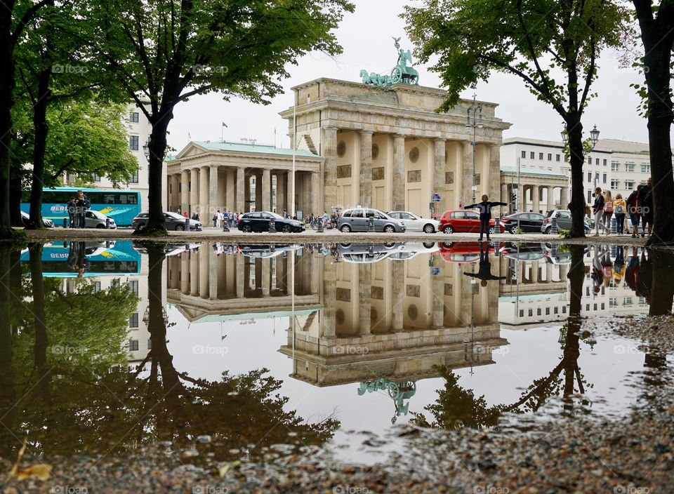 Puddle showing mirror image of Brandenburg Gate in Berlin 🇩🇪