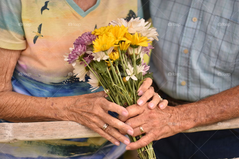 Senior couple holding a bouquet