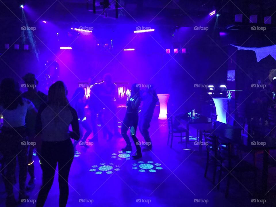 There are lots of people dancing at the glow party in Red Deer.