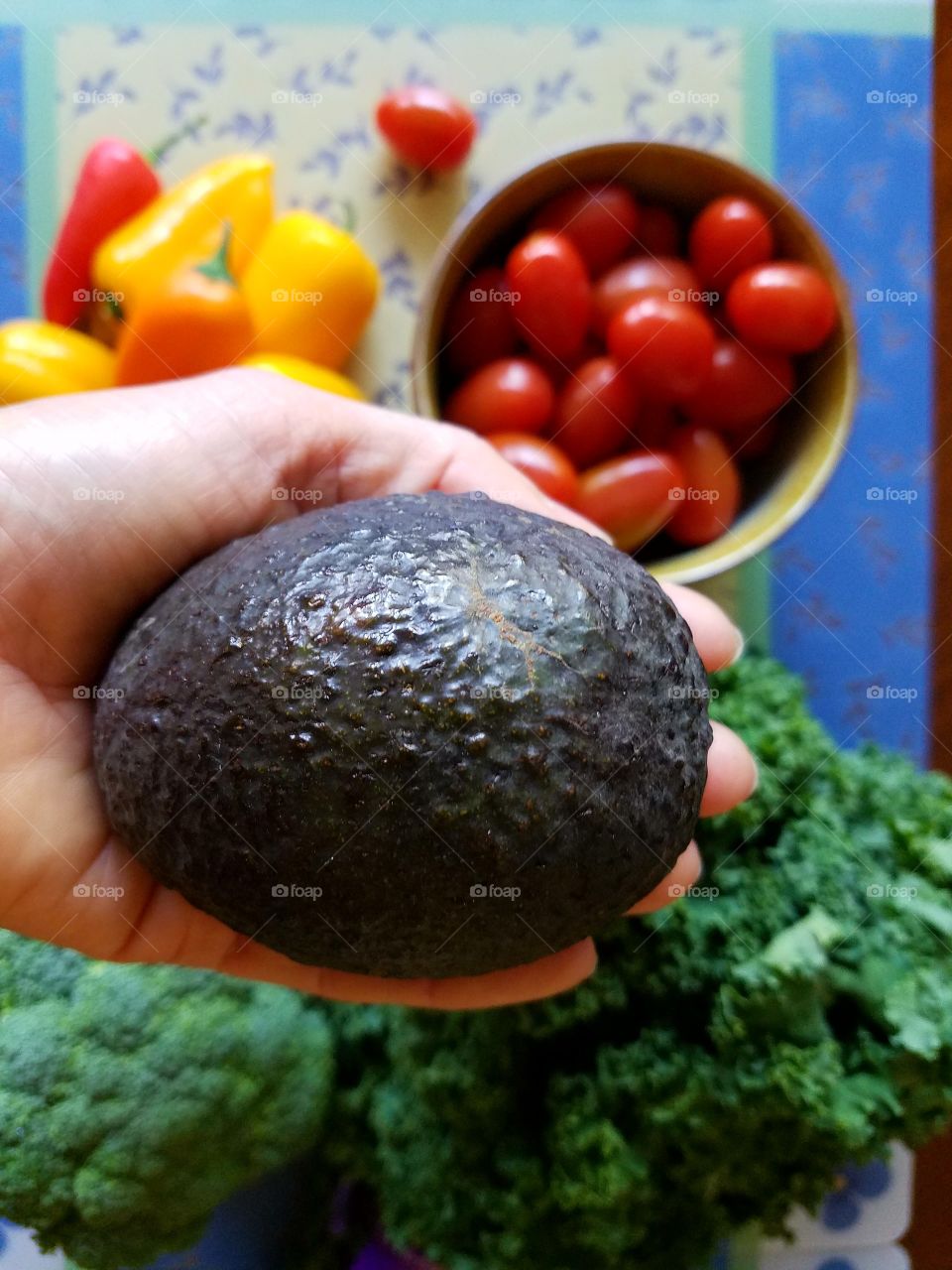 Close-up of avocado in hand