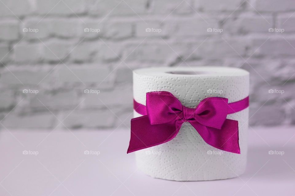 Toilet paper roll with pink bow