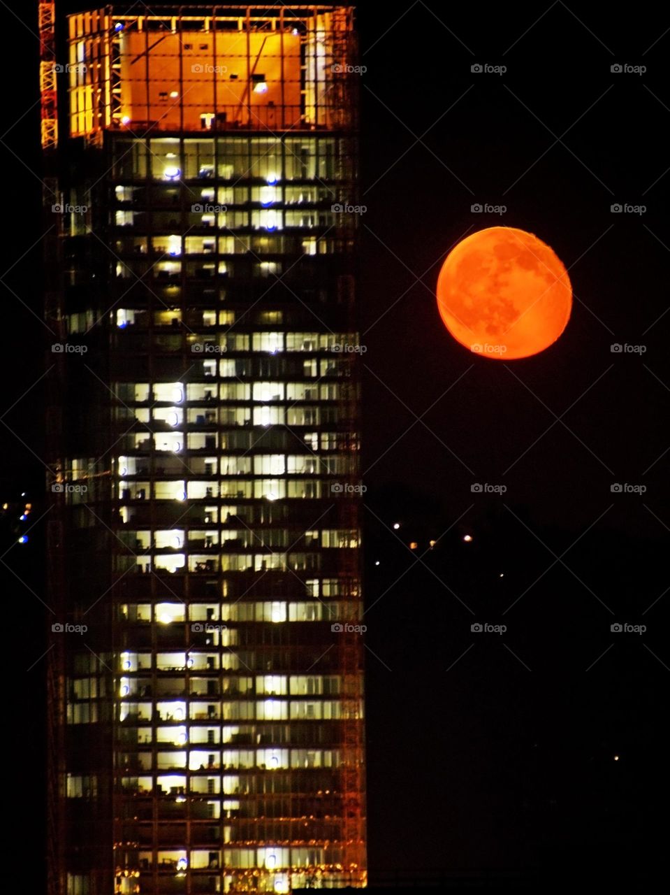 red moon and skyscraper 