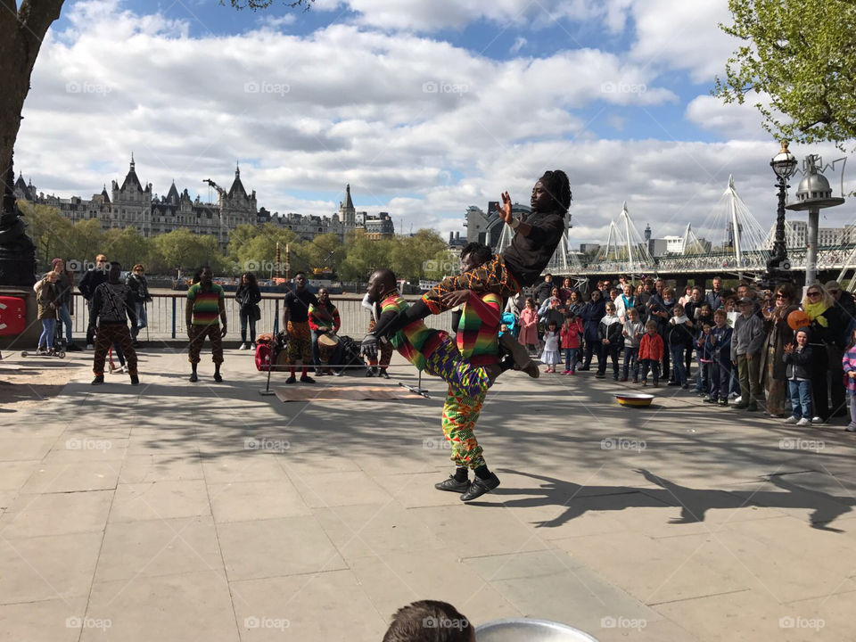 Street artists performing on the South Bank in London