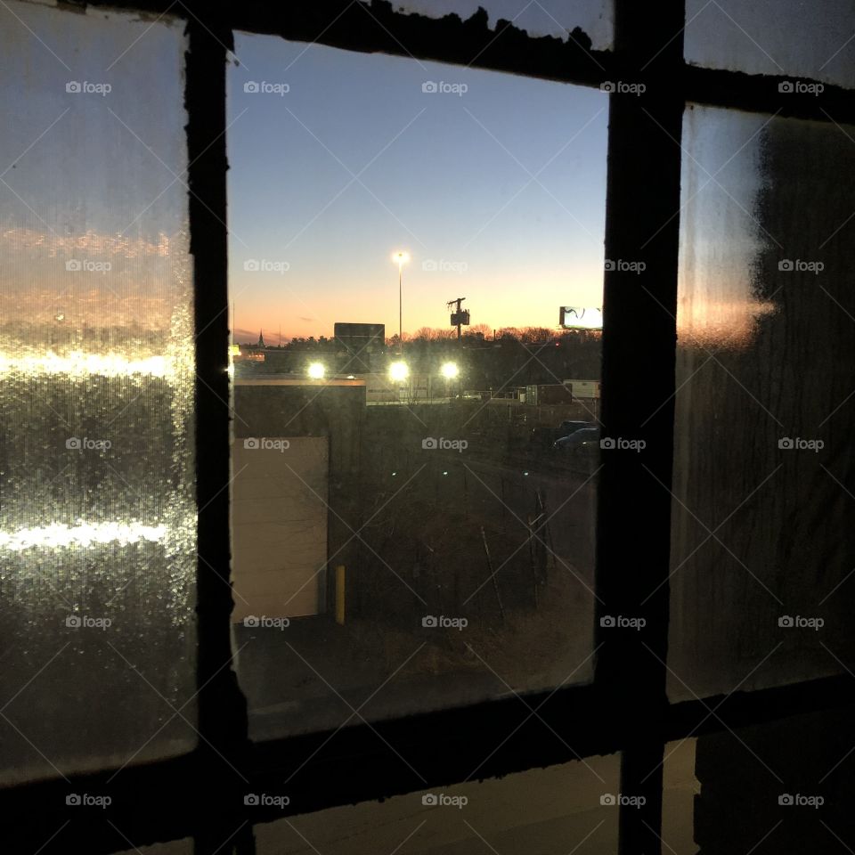 Sunset through a factory window. 