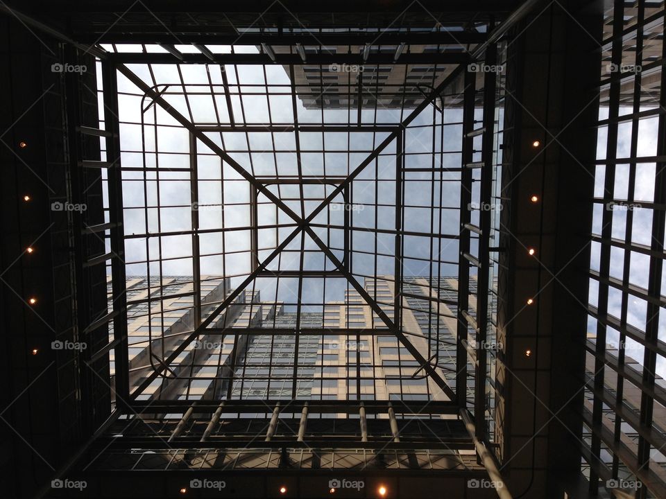 Looking up at buildings through skylight 