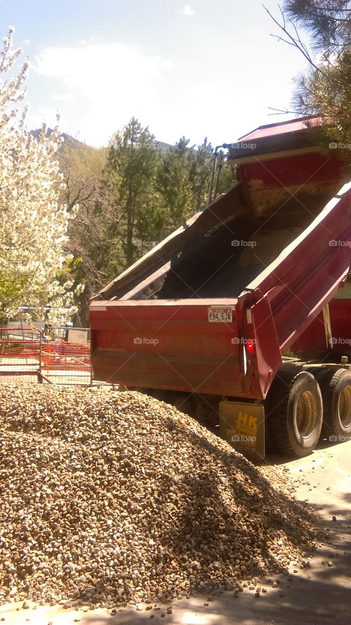 dump truck finishing dumping gravel