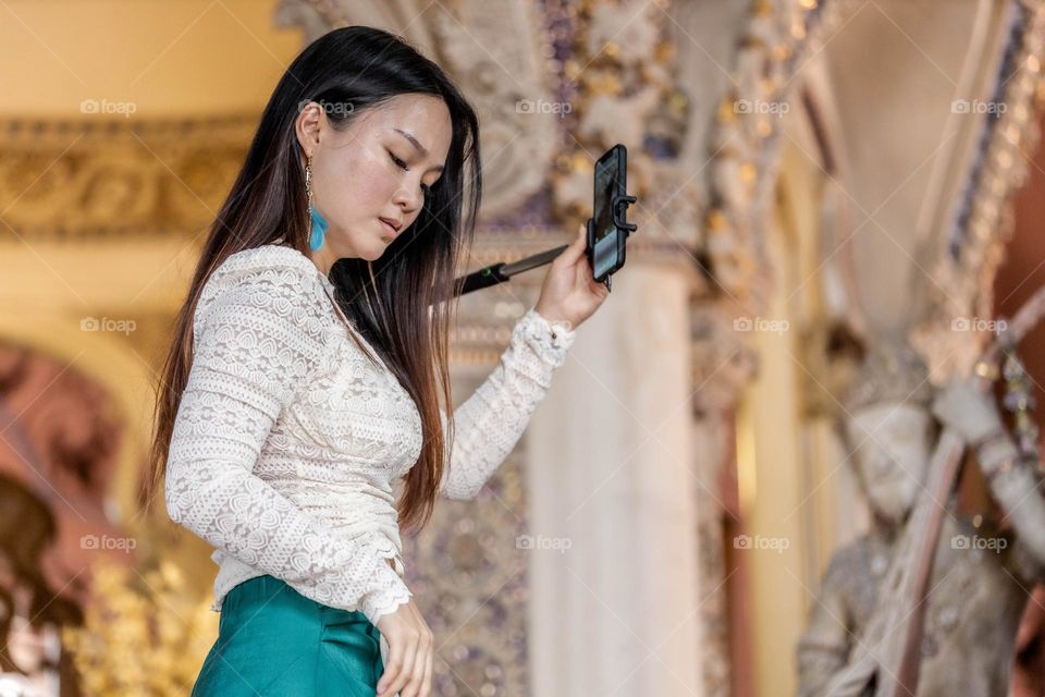 A Tourist taking selfie picture in Earawan museum