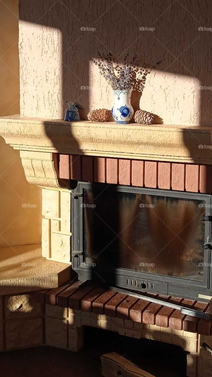 a mantelpiece illuminated by the sun